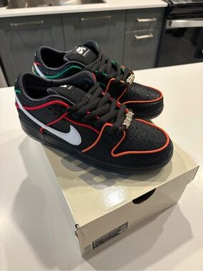 Nike Men’s Black Sneakers with White Swoosh and Orange/Red Trim